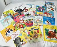 All 18 children’s books spread on table