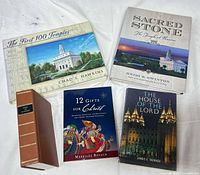 Group shot showing all five books arranged on white surface