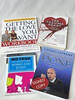 Four paperback books front covers visible