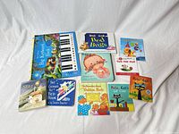 Overhead view of all ten children’s books showing covers and formats