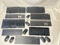 All keyboards, mice and receivers arranged flat for overview
