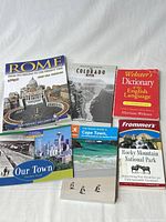 All six visible paperback books laid out together