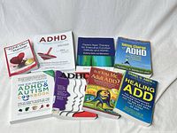Front view of nine paperback books displayed