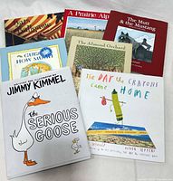 All eight listed hardcover children’s books grouped together