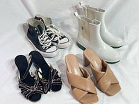 All four shoe pairs arranged on white backdrop