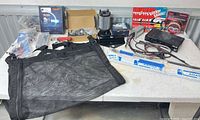 Table view of all items including speaker selector, lift supports, sticker packs, mesh net and small parts