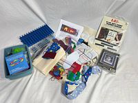 Group shot: Rainbow Loom set, felt busy book materials, sealed magnet board and cross-stitch kit