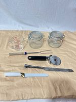 Group shot: all eight kitchen items laid out on cloth