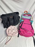 All four bags together: Modoker tote, Himal backpack, personalized Ann backpack, rainbow mini backpack