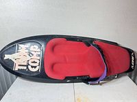 Full view of O'Brien Team Comp kneeboard showing red pad and strap
