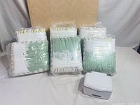Six packs of Pampers diapers and OXO wipes warmer