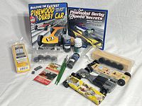 Full lot showing books, cars, kit, parts and tools