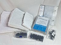overall lot showing packaged liner, three towels and three boxes of curtain clips