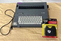 Front view of Smith Corona SL 500 typewriter with power cord and sealed ribbon
