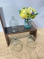 Full lot: jar with flowers on stand, three cloches