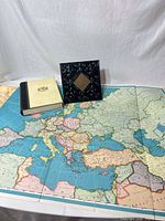 Overview showing fold-out map, frame, and storage book