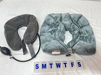 All three items: weighted neck pillow, inflatable neck pillow, pill organizer