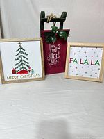 All three items: two framed wall arts and red wooden sleigh