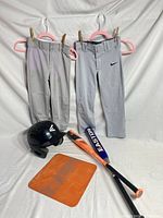 Complete lot with pants, helmet, base, and bats