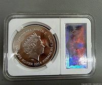 Obverse of encapsulated coin showing Queen Elizabeth II portrait, denomination, year, metal content, and hologram panel