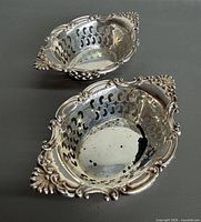 Two Birks sterling pierced bowls top view