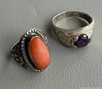 Two sterling silver rings side by side showing stones and overall design