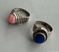 both sterling silver rings, pink rhodochrosite and blue lapis stones top view