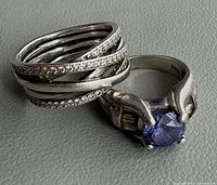 Pandora Entwined ring beside Thai blue stone ring