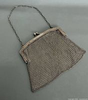 Full view of silver mesh evening bag with chain handle