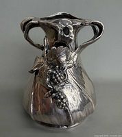 Front view showing grape motif and double handles