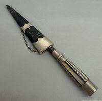 Full view dagger sheathed in scabbard with chain