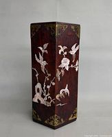 Front view showing bird and flower inlay and brass mounts
