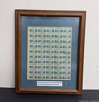 Full view of framed stamp sheet