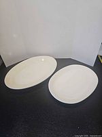 Two white oval platters top view