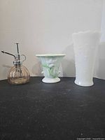 Group shot: milk glass vase, Akro Agate vase, glass atomizer