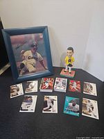 Lot overview showing framed Matt Williams photo, bobblehead, and trading cards