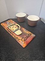 Overall view of two cups and coffee décor plaque