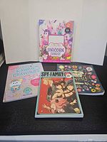 Four activity books front covers displayed