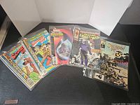 Group shot of all five bagged comic books