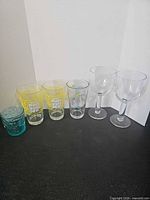 Full lineup of six glasses on surface