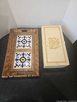 Top view of wooden tray and Philip Morris cigar box