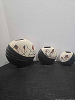 Front view of all three hand painted vases
