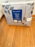 Front view of packaged Bellisimo queen comforter