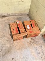 Two Bernardin cardboard boxes on basement floor