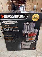 Front of retail box showing Black & Decker KitchenTools 12-cup food processor with 4-cup nested workbowl image