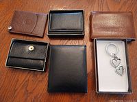 Overview of five leather pieces and boxed keychain