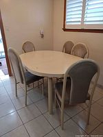 Full view of dining table with five chairs