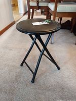 Full view of folded-out stool showing overall form