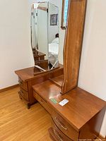 Full view of dresser vanity showing mirror, drawers and finish