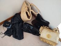 Group shot of six purses on floor
